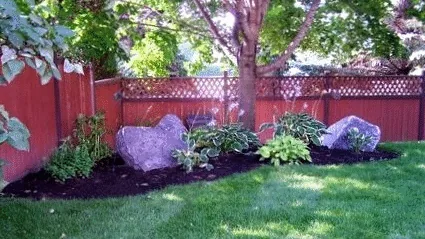 Corner garden boulder accents by Forever Green