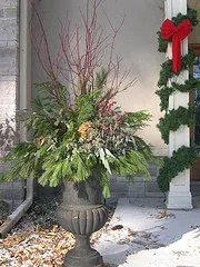 Winter Container Red dogwood, pine, bc cedar, magnolia leaves, pepperberries, hydrandea blooms seeded eucalyptus